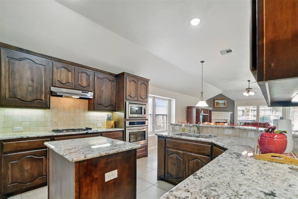 Upgraded granite and newer microwave in the kitchen