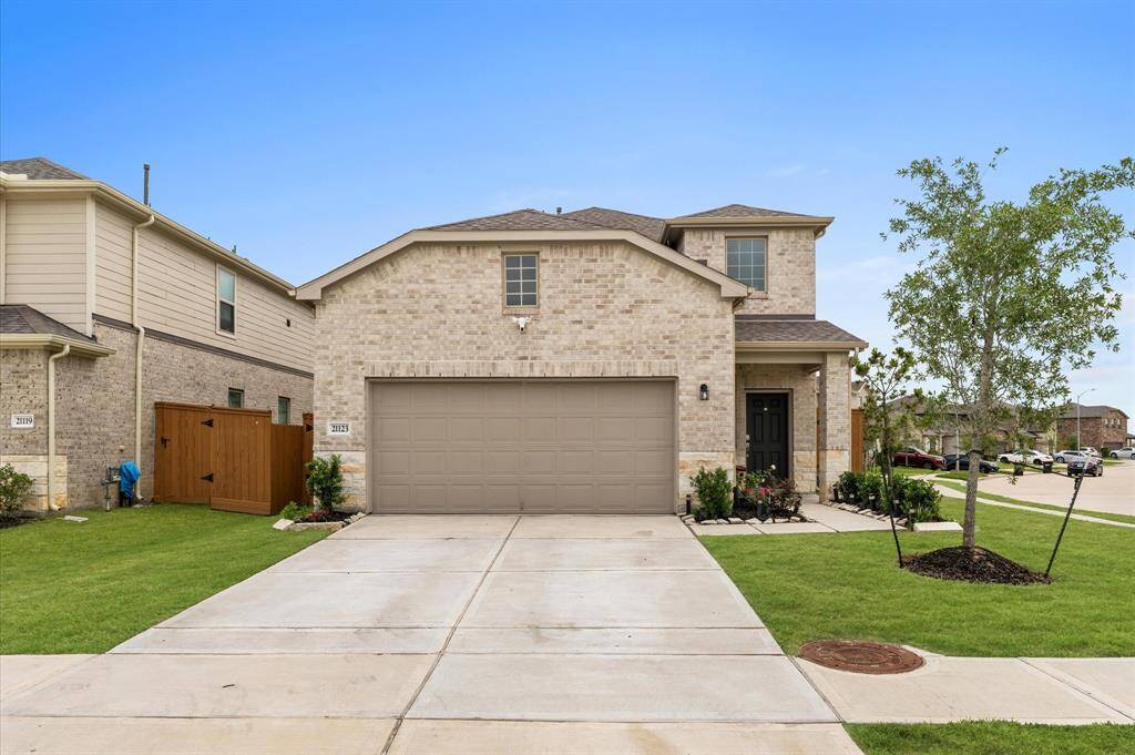 Welcome home! Take a look at the stunning brick and stone elevation.