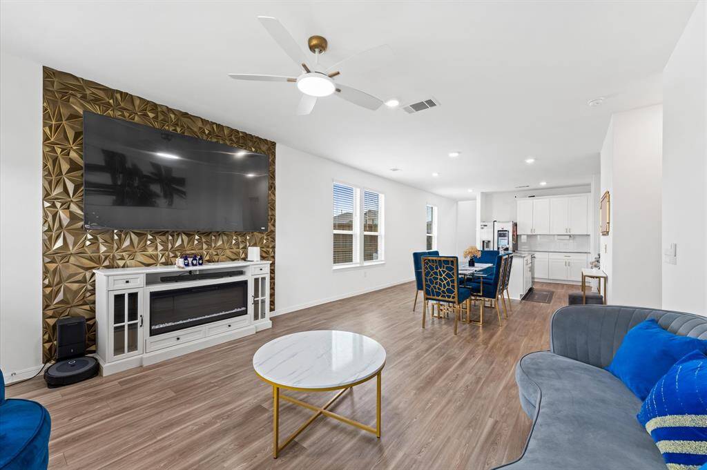 Open concept living area with plenty of natural light.
