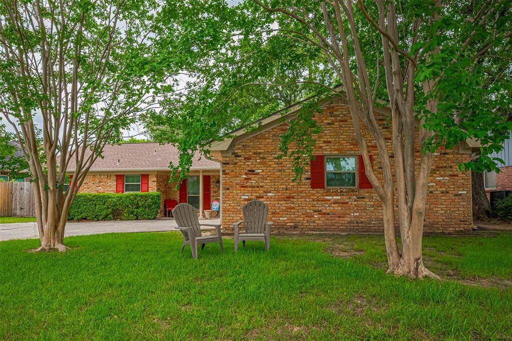 Home offers a lovely shaded front yard on a friendly street with sidewalks on both sides, where neighborhood families commonly gather to play