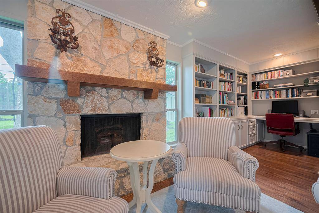 Cozy library and computer desk, complete with filing cabinet drawers, tucked in the corner off of the main living area.