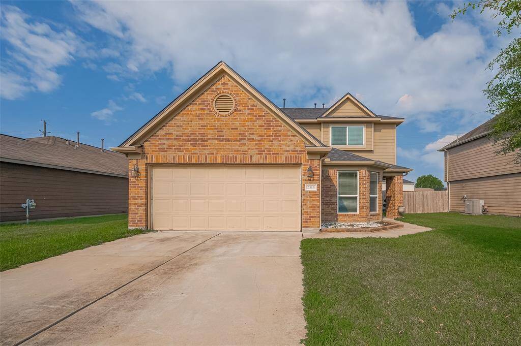 Welcome to 2315 Zephyr Lane. With a timeless blend of brick and siding, large front-facing windows, and charming curb appeal, this home offers both style and comfort at first glance.