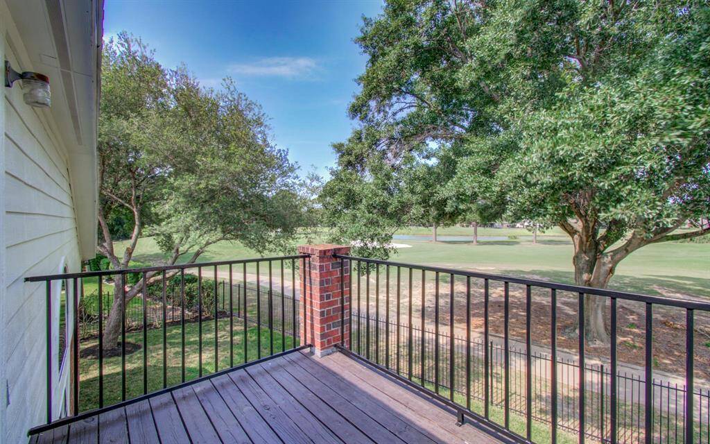 Private 2nd story deck leading to the study and looking over the golf course.