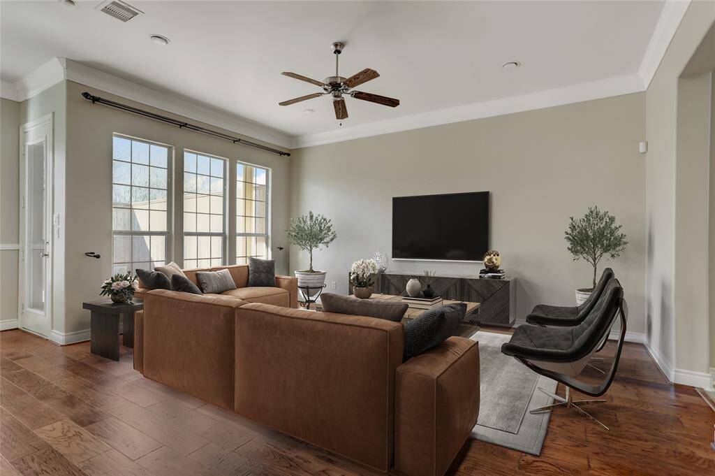 Here's a closer look at the living room area, where the windows to the left fill the space with abundant natural light. This bright and open layout makes it a comfortable spot for relaxing or gathering with guests. This photo is virtually staged.