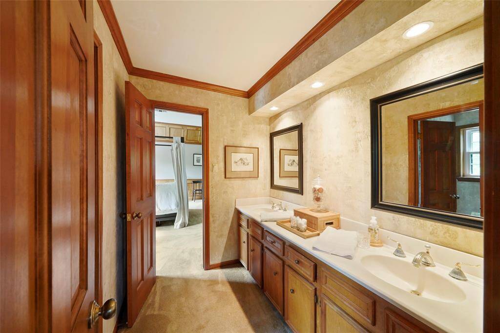 Jack & Jill bathroom conveniently connects the secondary bedroom to the game room, perfect for easy access and shared use.
