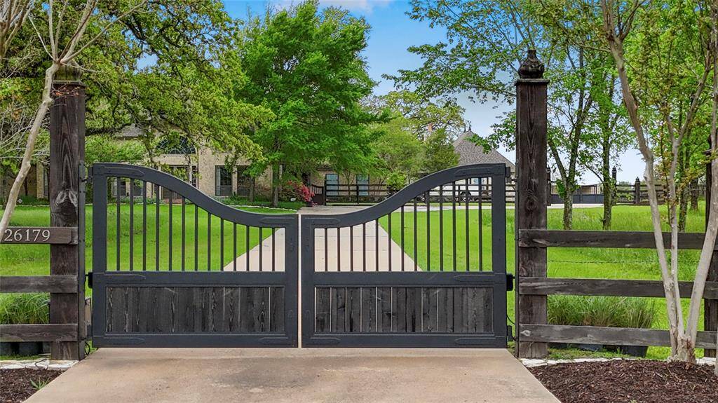 Gated entry to the main house with remote/key access.