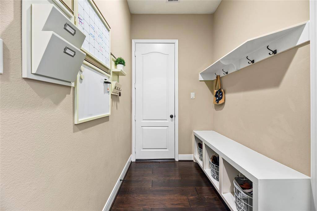 Utility room with wall-mounted storage.