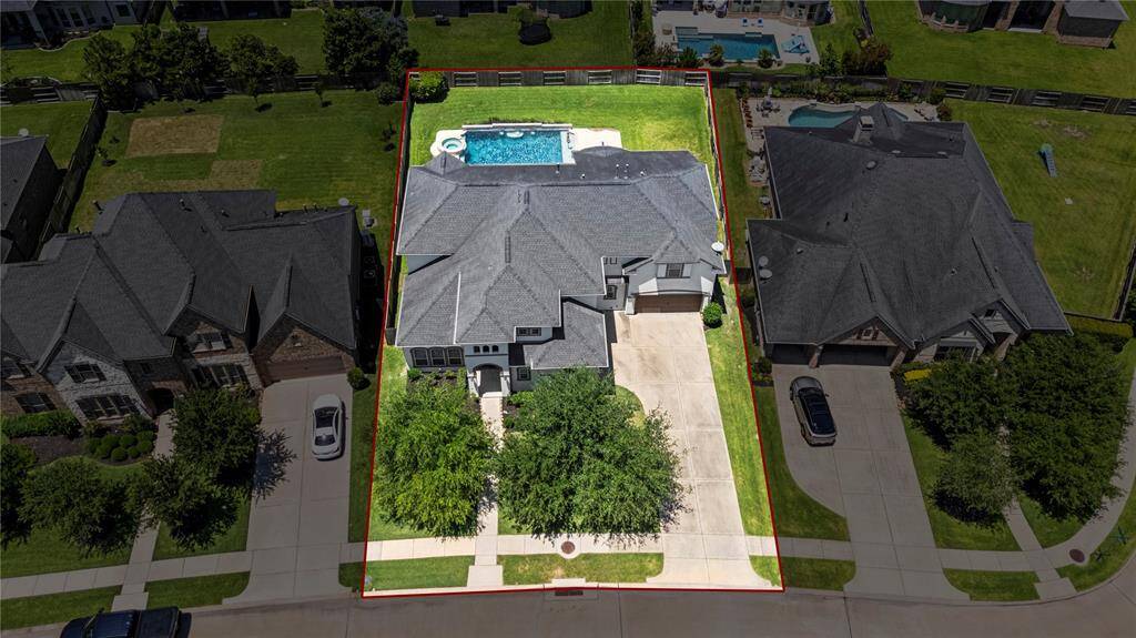 Another aerial photo of the home showcasing the front of the home.