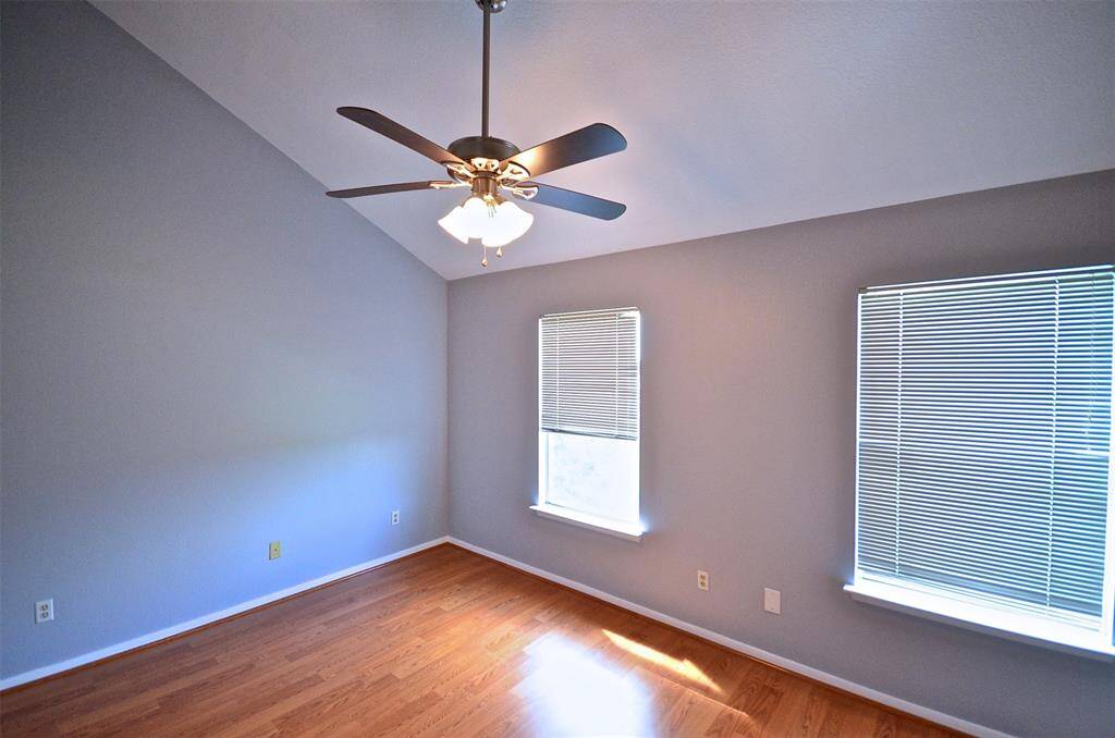 2 bedrooms upstairs, each has its own full bathrooms. This is the bedroom in the back, high ceiling, ceiling fan, fresh paint, wood floor, no carpet!