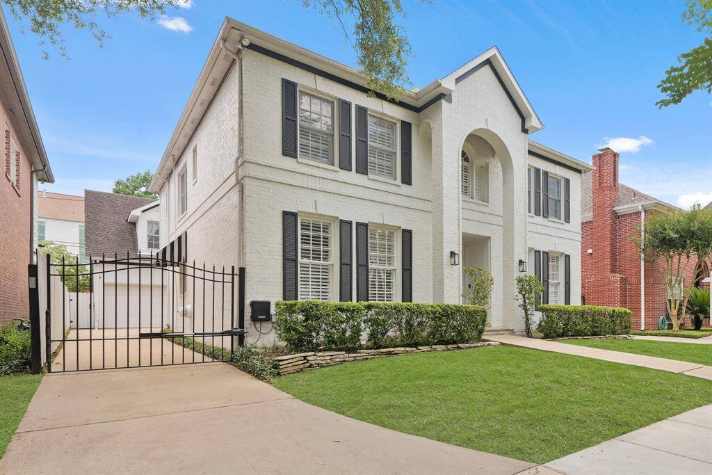Sleek architectural details with a long gated driveway offering private access to the detached garage and parking.