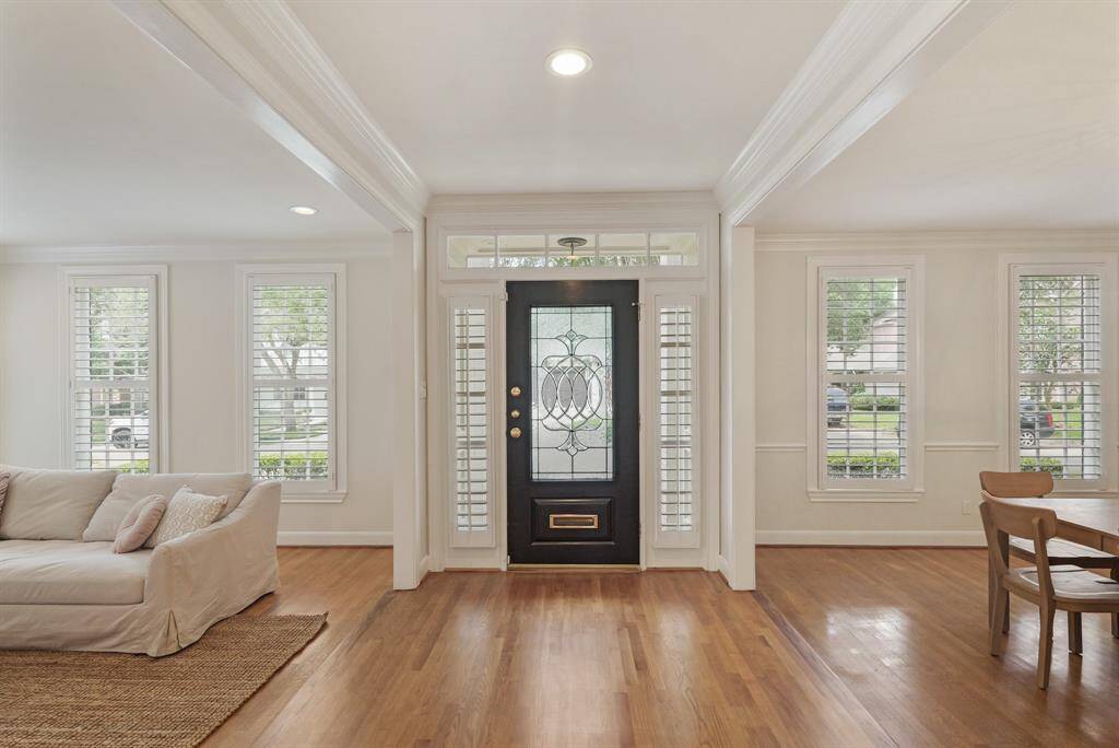 Welcome home! The elegant Entryway welcomes you with natural light and flows effortlessly into the Formal Living and Dining Rooms—perfect for both entertaining and everyday living.