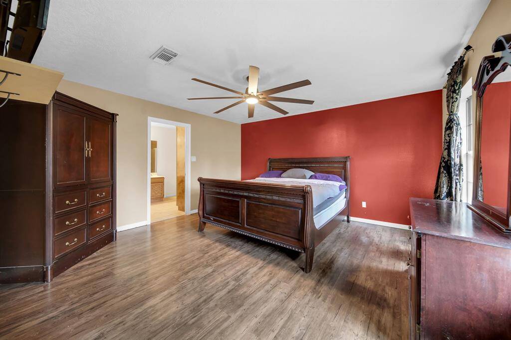 Primary bedroom provides plenty of room with adjoining bathroom.