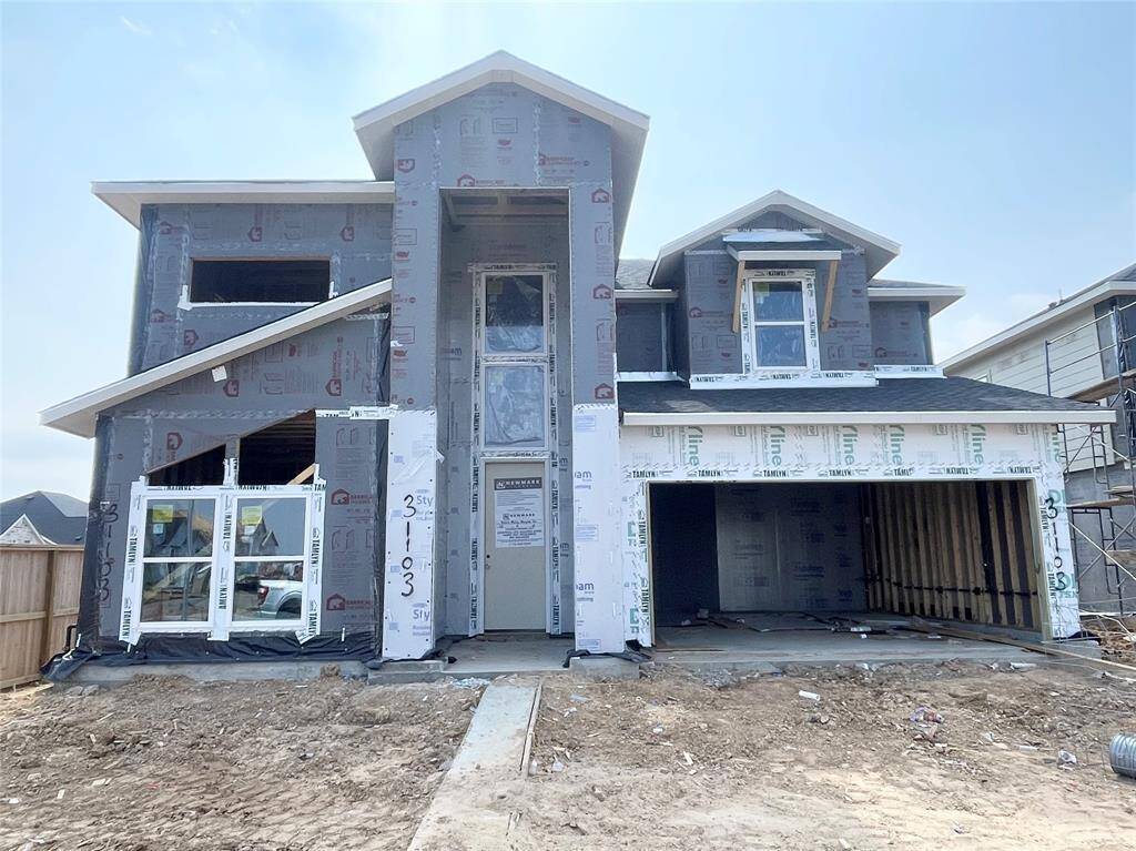 Modern Front Elevation With a Custom Window And Clean Lines