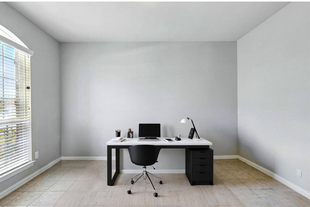 Versatile front flex room perfect for an office, formal living, or dining area. (Virtually Staged)