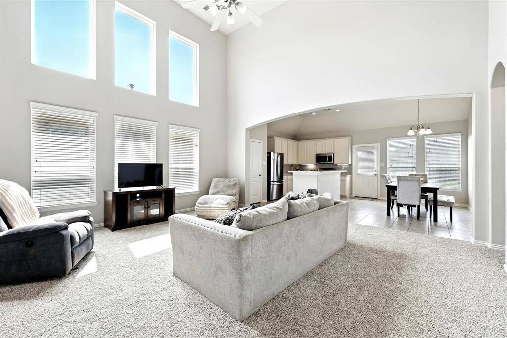 Stunning two-story windows in the family room flood the space with natural light.