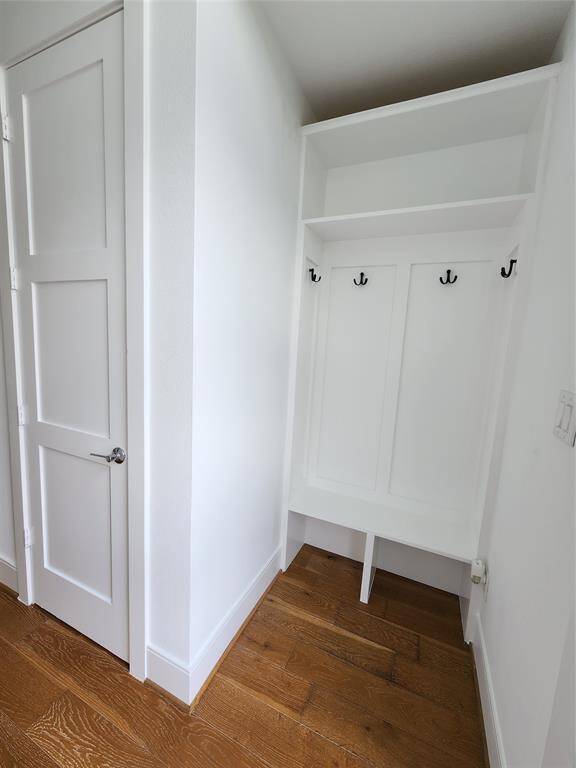Custom-Builtout mudroom with abundant built-in storage, perfectly positioned next to the entry foyer's coat closet