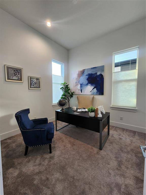 Enjoy the versatile first-floor bedroom or home office, featuring a spacious walk-in closet and private access to the adjacent full bathroom—ideal for guests or multigenerational living