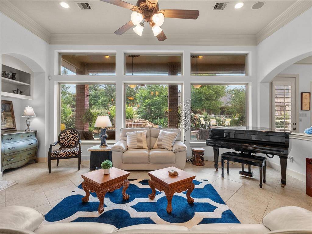 Open-concept living with soaring ceilings and walls of windows.