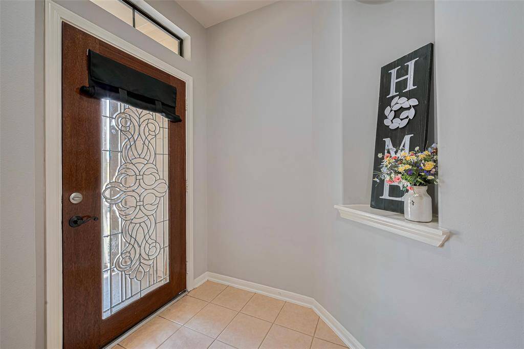 Light and bright entry with stylish wall niche to display your favorite art.