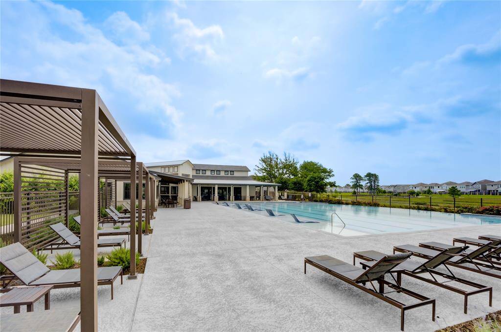 Community pool with fitness center and outdoor walking trail