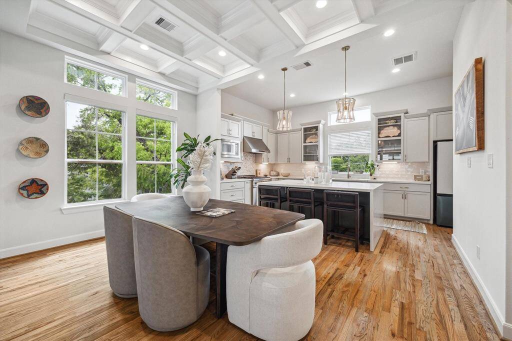 Elegant, modern ceiling design defines the dining space