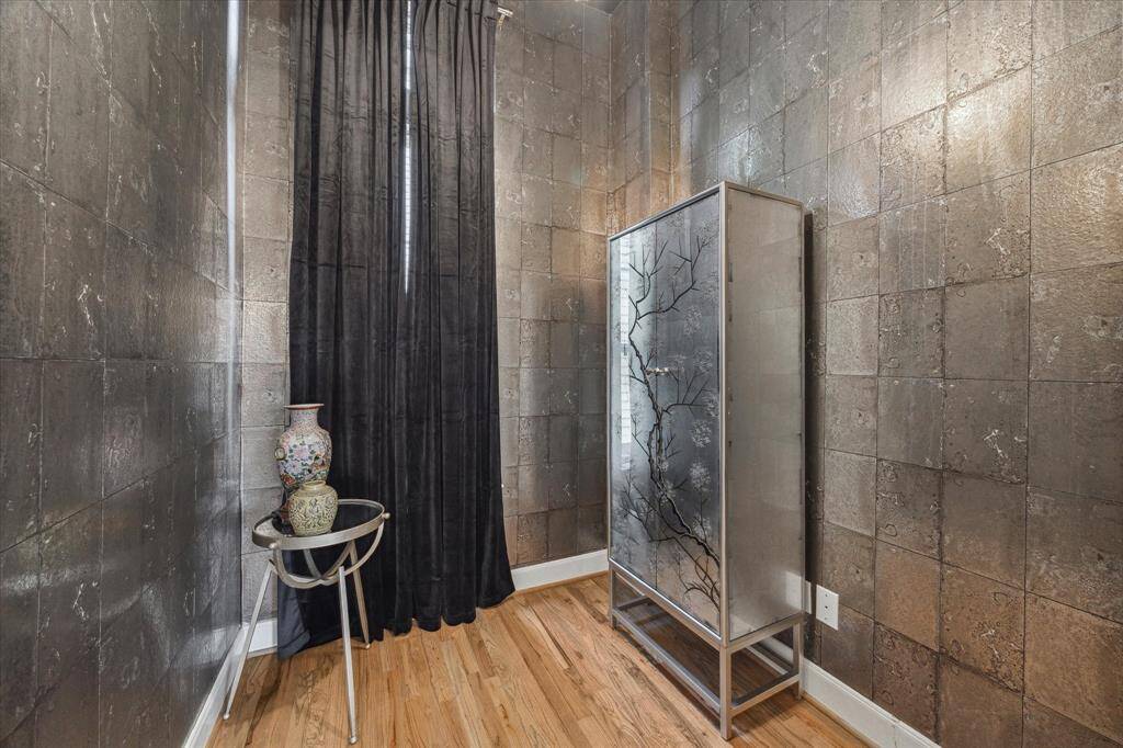 This stunning room can be anything you want - a small office, wine room, or sitting area - located on the second floor as you ascend the stairs.