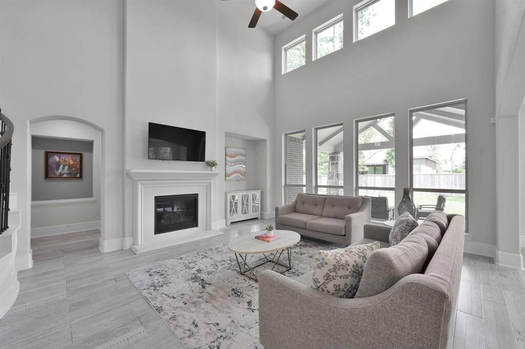Primary bedroom is located downstairs and tucked into the corner of the living room.
