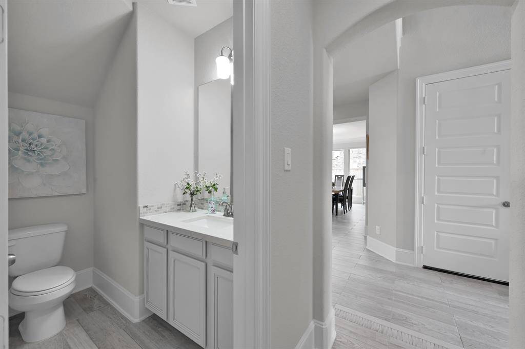 Secondary bathroom located downstairs towards the front of the home.