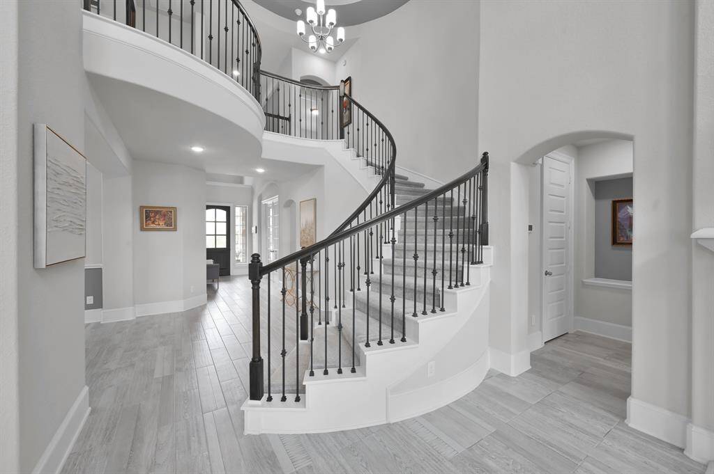 Spiral staircase offers the perfect focal point in the home!