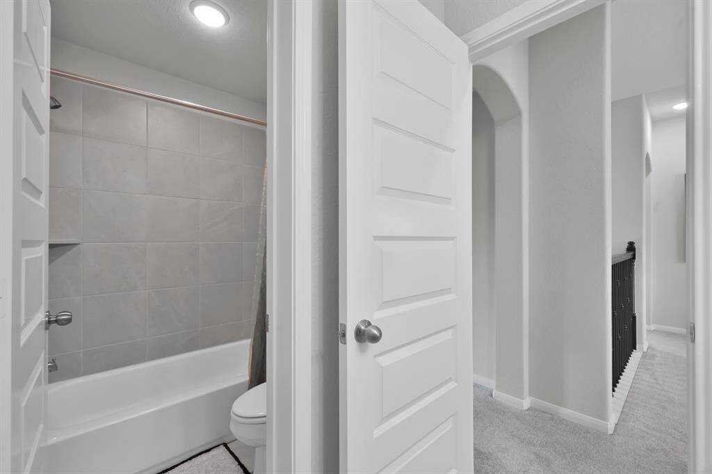 Secondary bathroom #1 located upstairs near the game room.