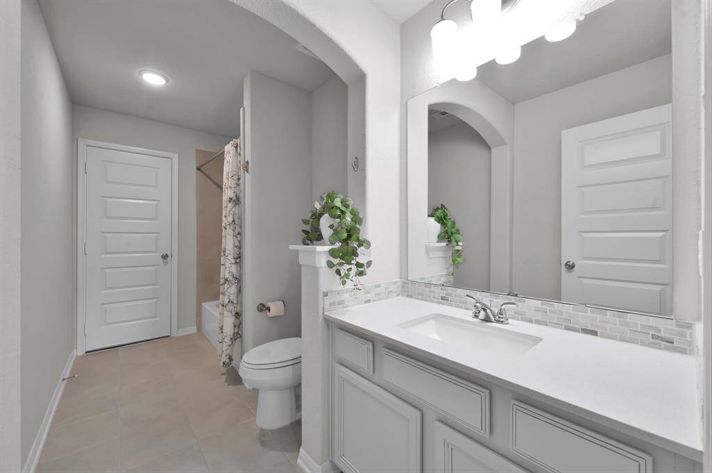Secondary bathroom #2 located upstairs inside secondary bedroom #3.