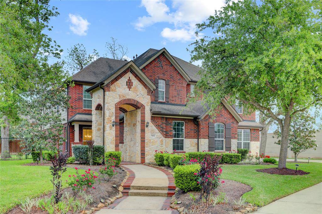 5402 Bending Branch located at the front of Sienna on a huge cul-de-sac lot in the gated and sought-after Pecan Estates!