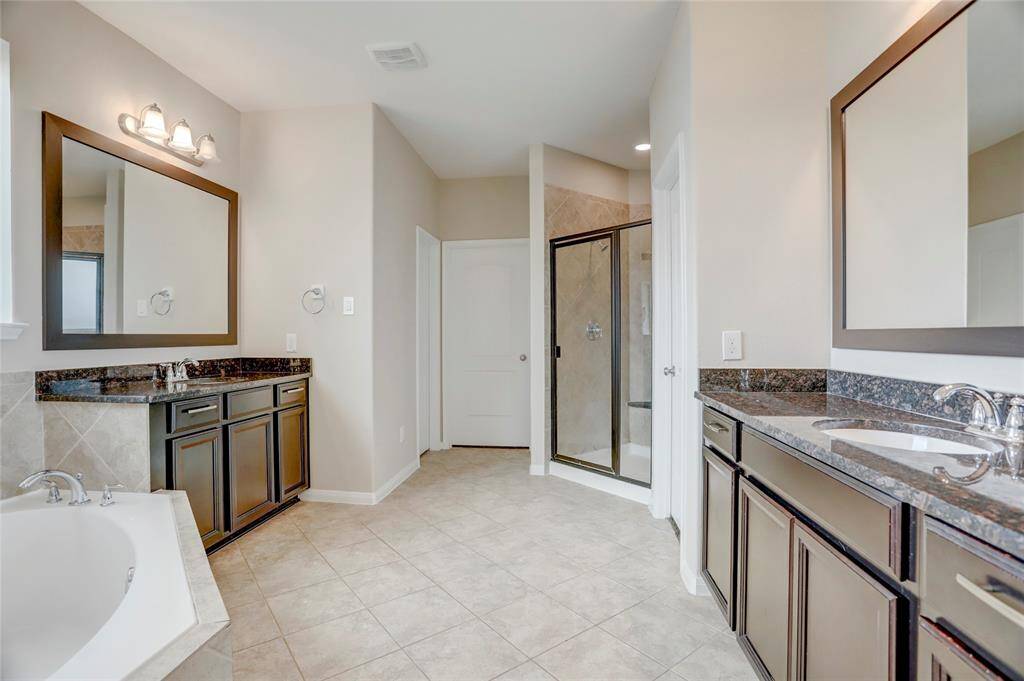 Primary bath with two walk in closets