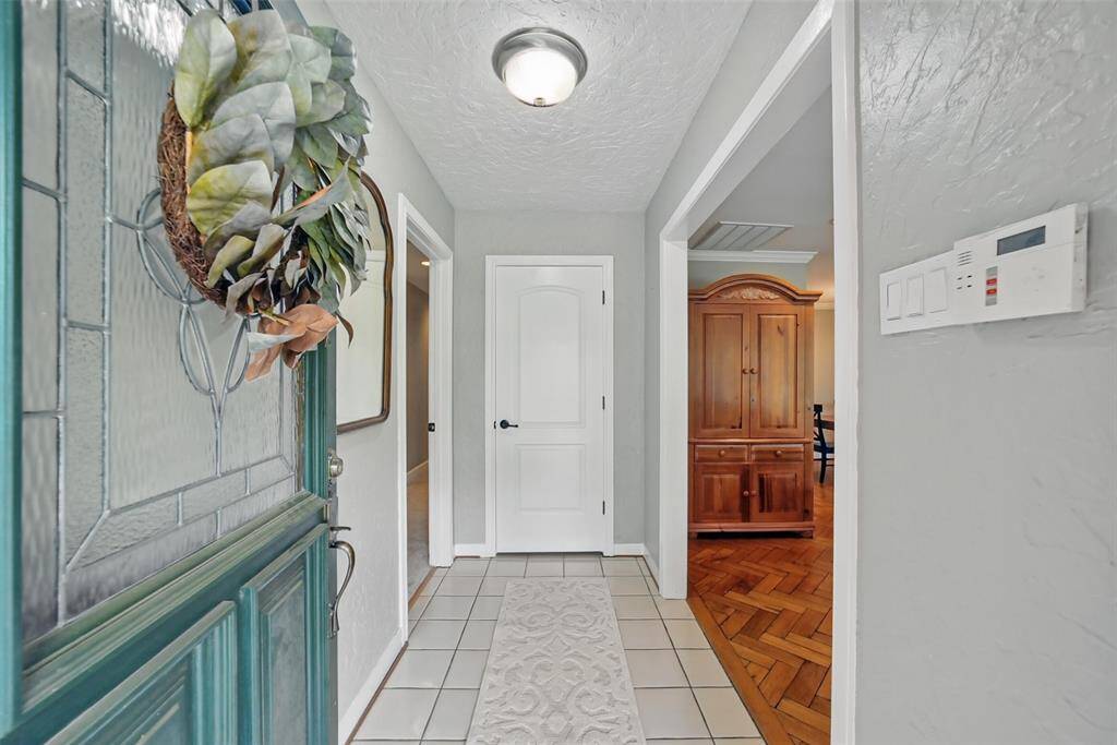 THE FRONT DOOR OPENS UP TO THE ENTRANCE HALL.