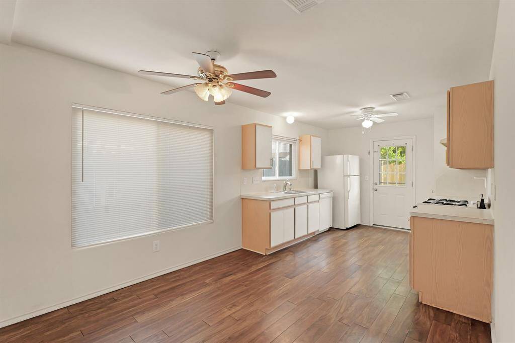 The dining area with ceiling fan and lighting
