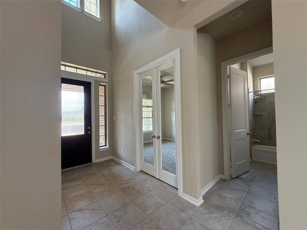 Entryway with vaulted ceiling