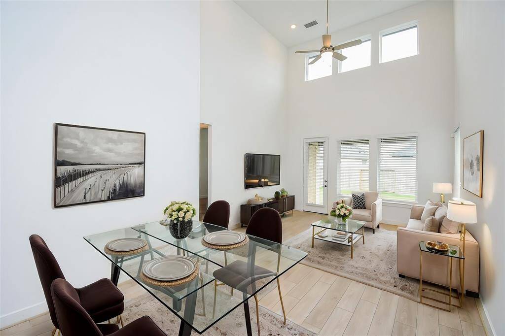 Bright, open-concept living and dining area, beautifully virtually staged for style and functionality.