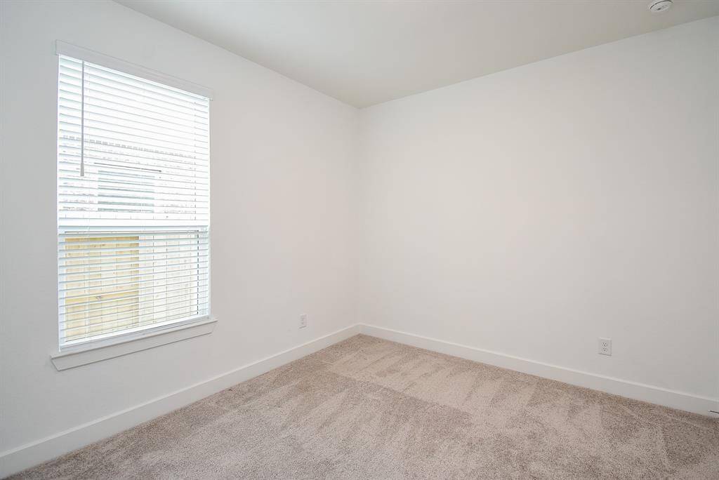 Convenient downstairs bedroom with natural light.