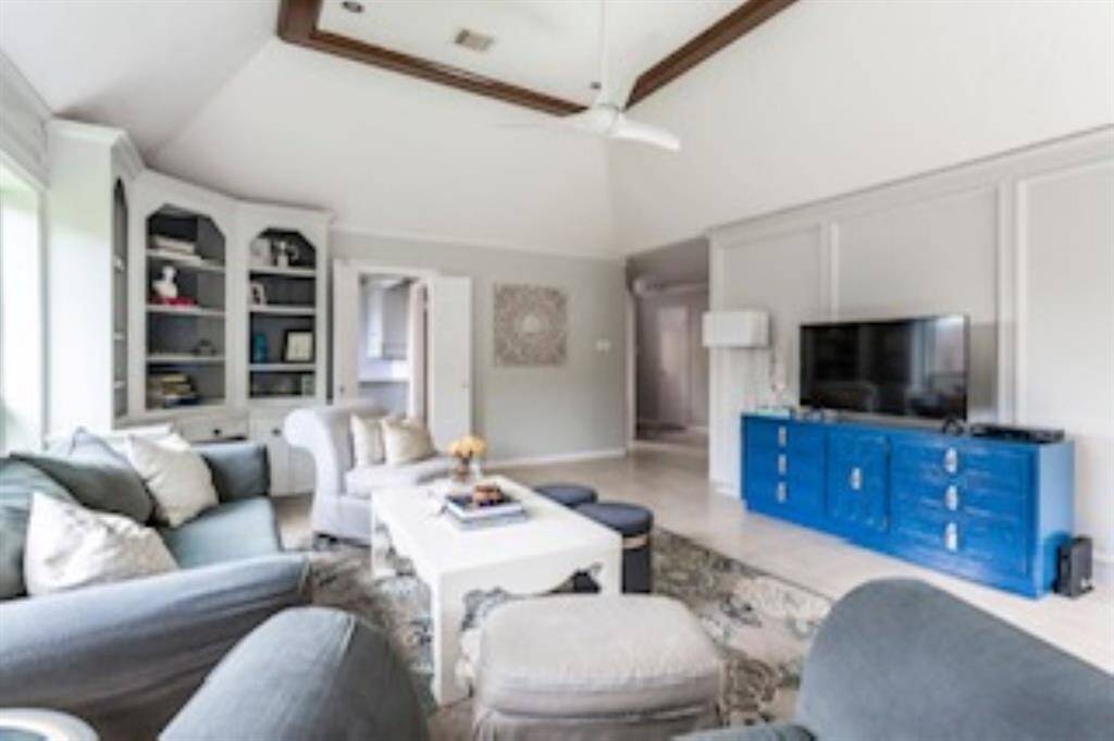 Imagine the sounds of laughter and chatter as you create lasting memories in this beautiful home. With its spacious layout and light-filled design, the family room sets the perfect stage for everyday moments and special gatherings alike.