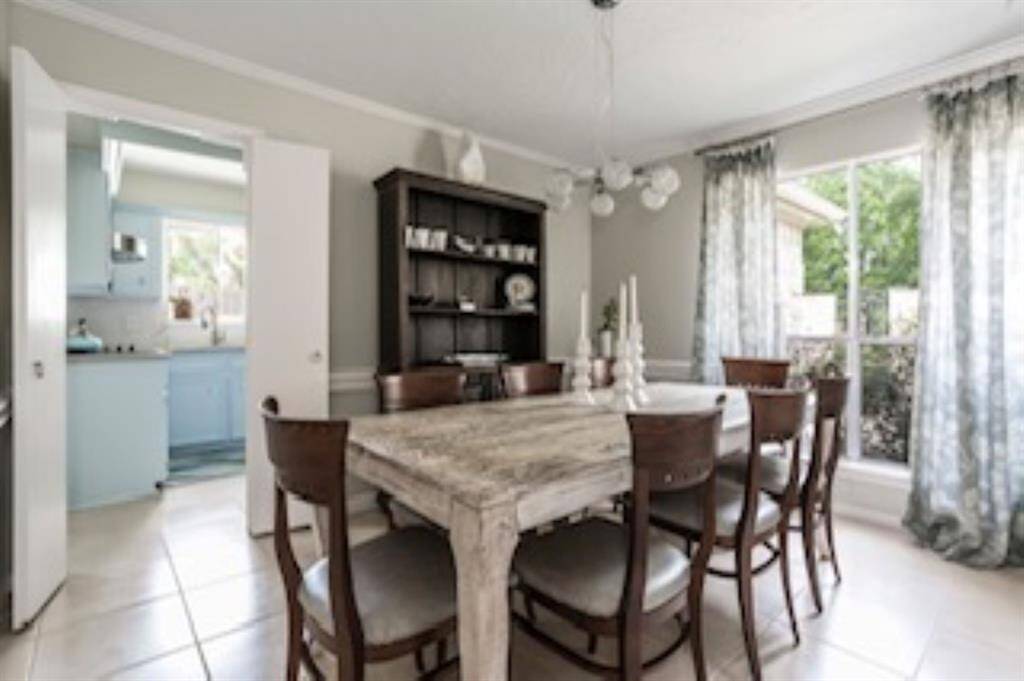 Host everything from festive holiday feasts to casual weeknight dinners in this elegant formal dining room. Oversized windows fill the space with amazing natural light, while neutral tones, classic millwork, and easy flow into the kitchen ensure every meal feels like a special occasion.
