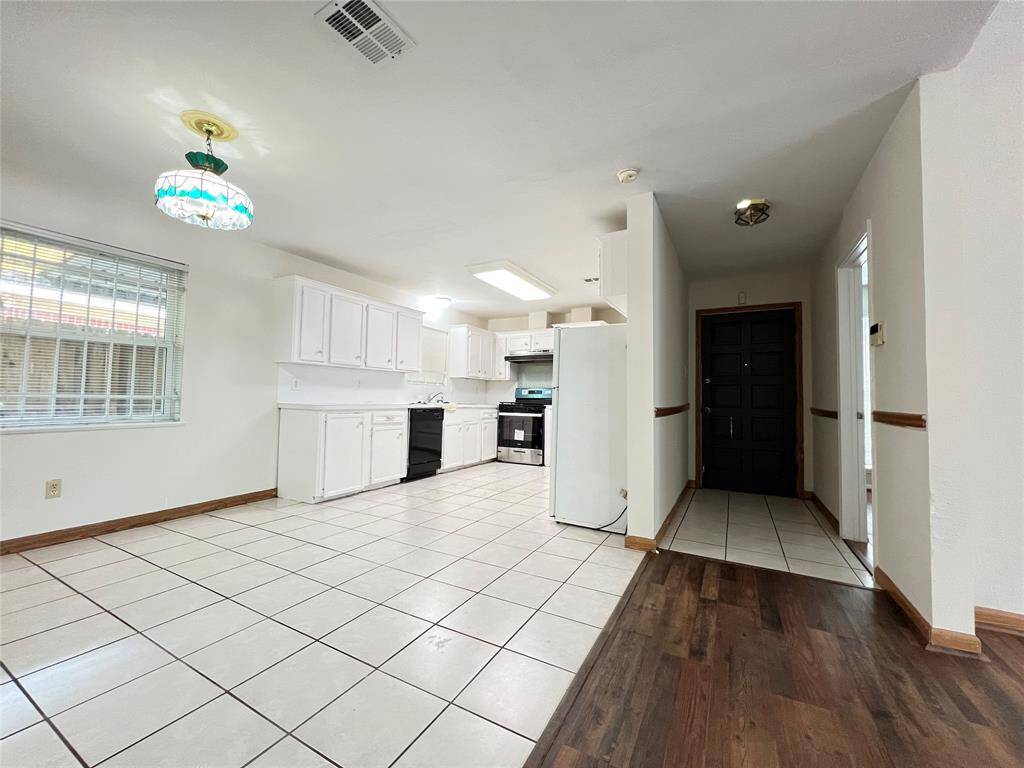 front door and kitchen