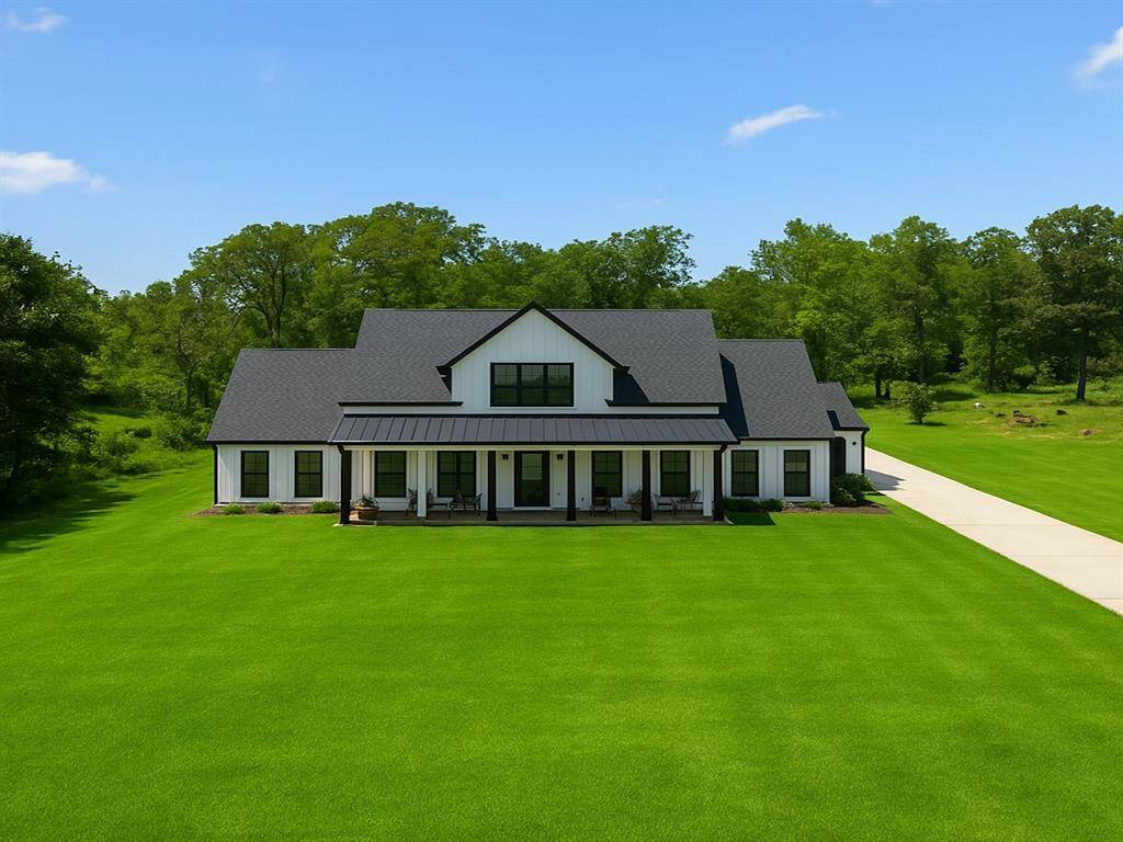 Green grass edited to show what is coming, new grass is planted and coming in strong. Beautiful open front yard.