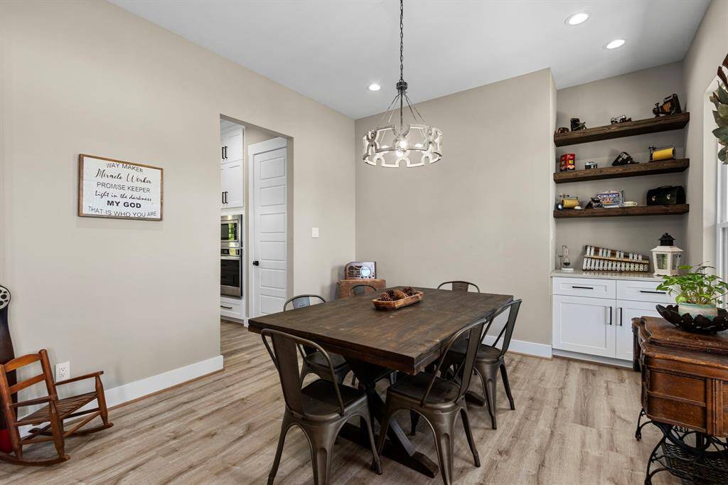 Entry into the kitchen of course is just off the side. Still having privacy from the open common areas of the home, tailored for a formal dining experience.