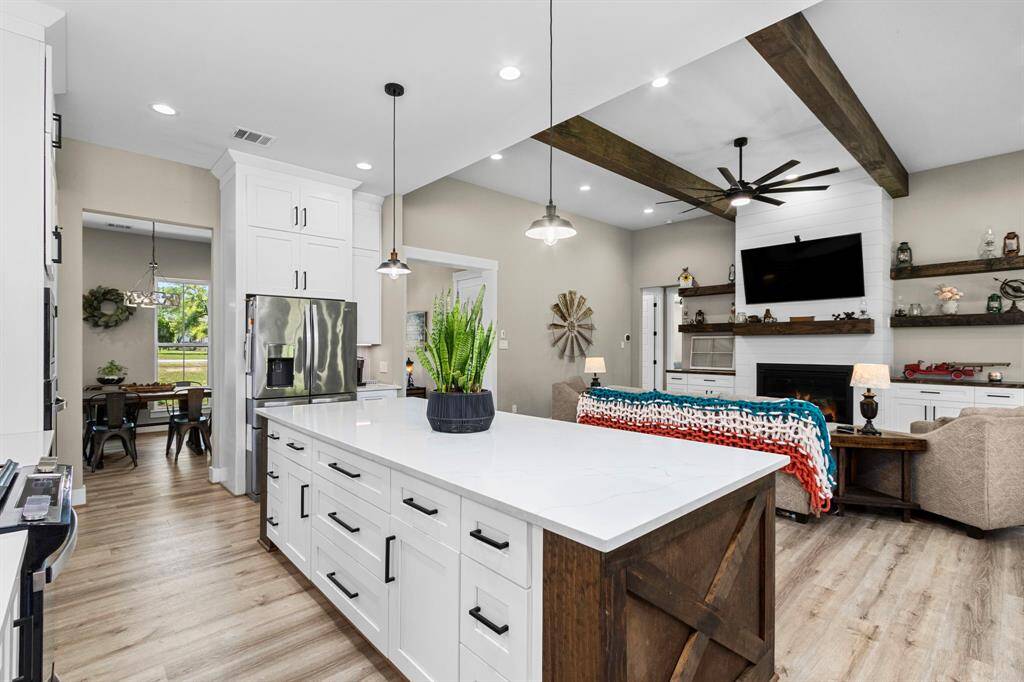 Your view as you host from your kitchen to be apart of the living space as you host.