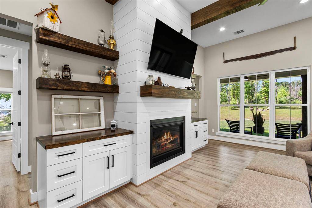 Custom shiplap work and gas fireplace to cozy up your space.
