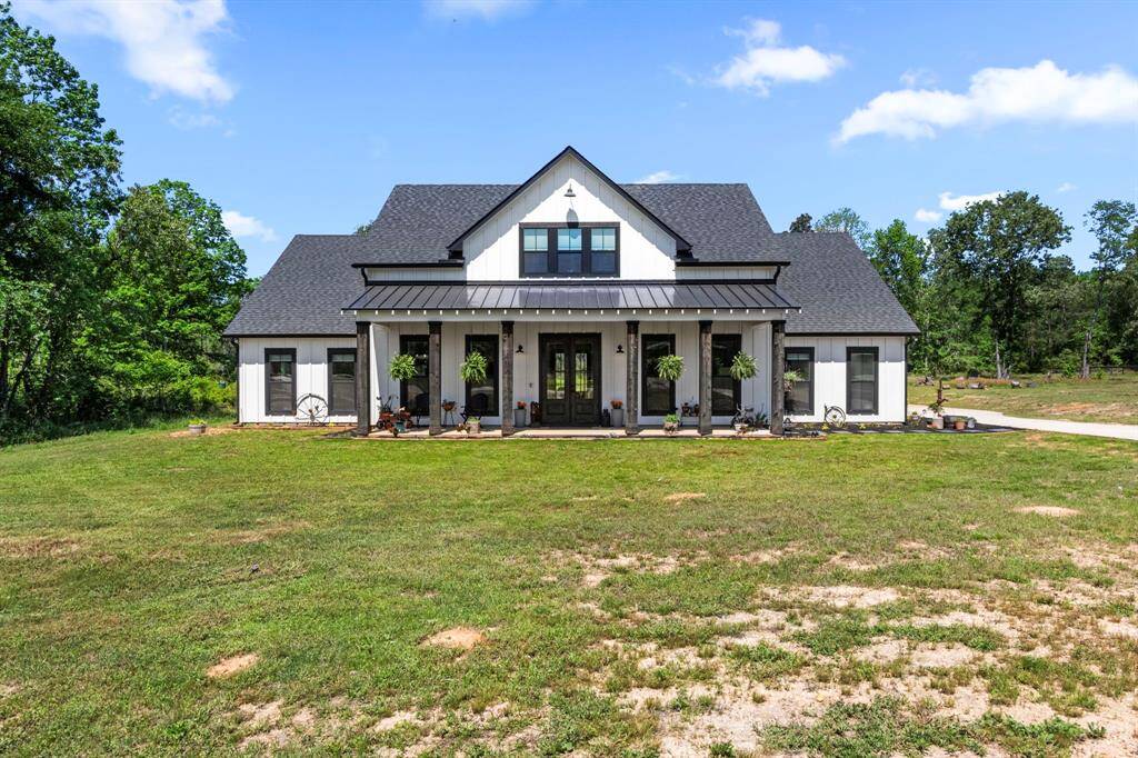 Front view showing the current state of the yard, green manicured grass to come.