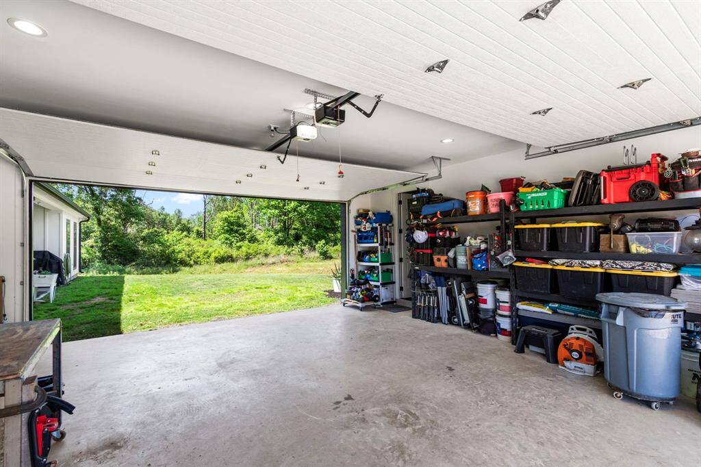 Two car garage that opens through with a second door to the backyard.