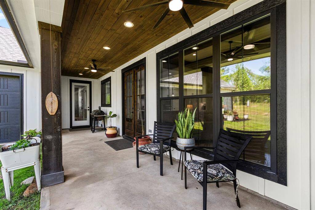 Large back patio with the most serene feel as you are welcomed by the large trees surrounding this property. You have gas an electrical connections for a possible outdoor kitchen.