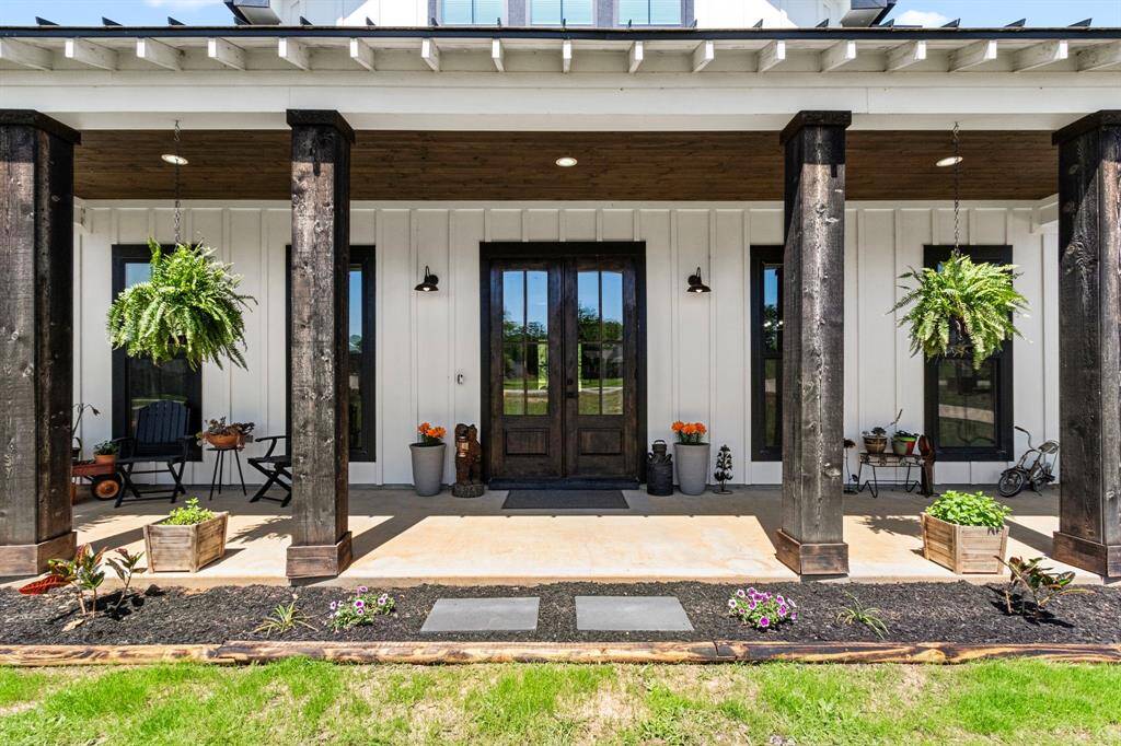 Large dark wood cedar post complimenting your oversized front porch.