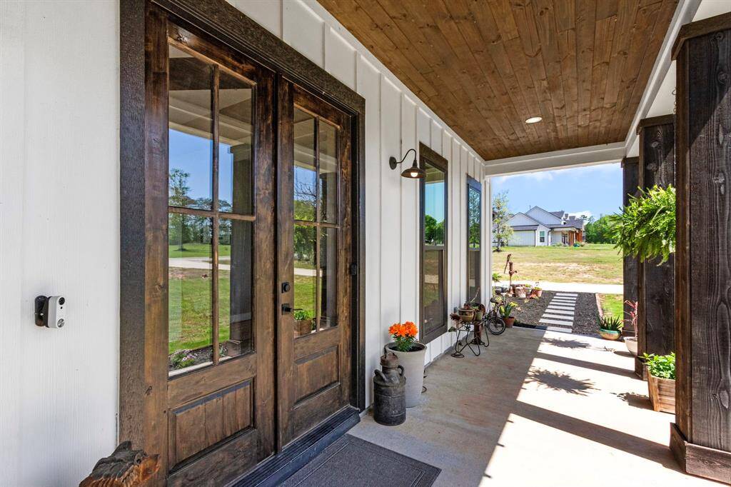 Grand view from this porch, with modern farmhouse finishes from top to bottom.